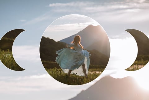 woman dancing in white dress with mountain in background