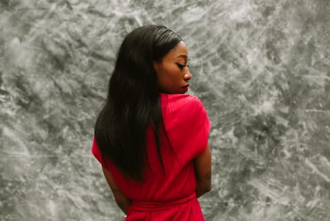Profile Portrait Of Woman Posing Over Grey Background Profile Portrait Of Woman Posing Over Grey Background
