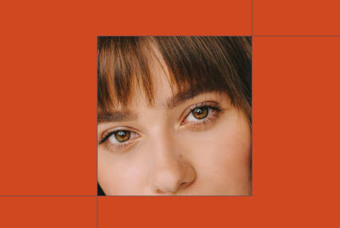 Best Mascar hero Woman wearing mascara on orange baackground Best Mascar hero Woman wearing mascara on orange baackground