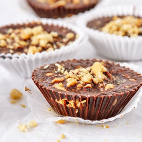 A simple recipe of coconut oil, carob powder, peanut butter, and peanuts makes these delicious and healthy chocolate alternative confection. A simple recipe of coconut oil, carob powder, peanut butter, and peanuts makes these delicious and healthy chocolate alternative confection.