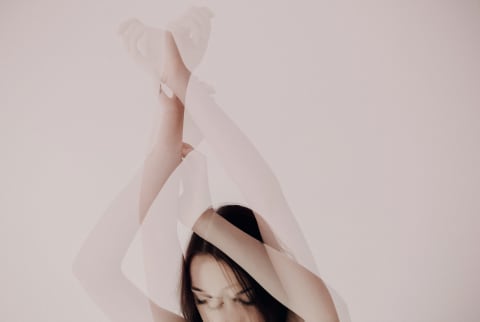 abstract photo of woman holding arms up abstract photo of woman holding arms up